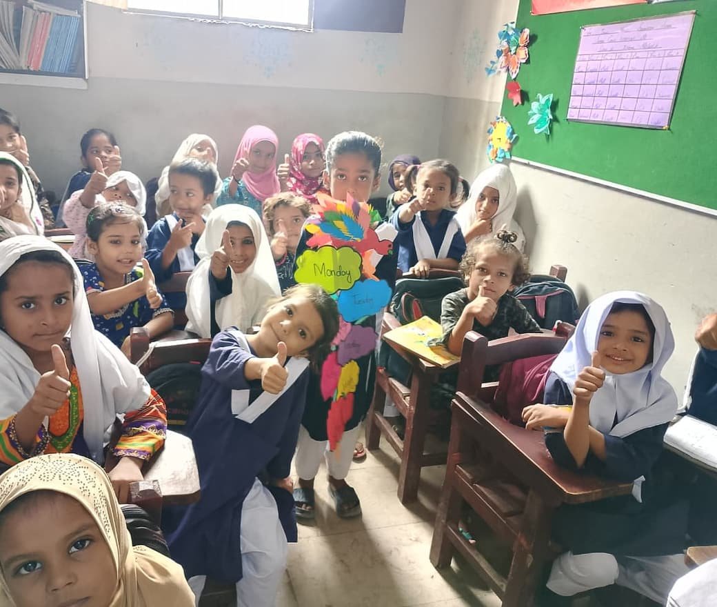 Students giving a thumbs up in a SkillUp Valley classroom